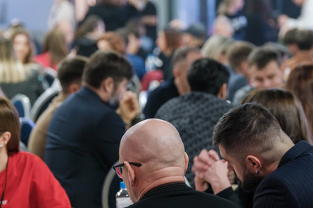 Crowd of people at a networking event, engaging in discussions and collaboration.の写真素材