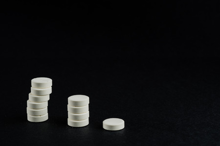 medicine, white tablet, black backgroundの写真素材