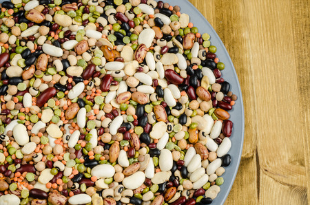 legumes in a dish on wood, close up, backgroundの写真素材