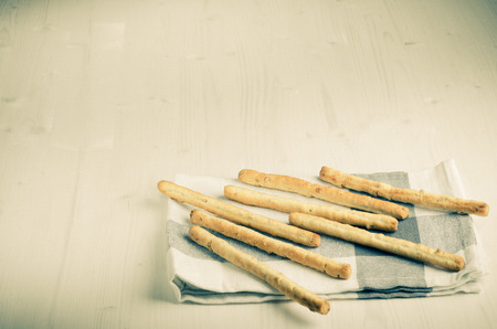rustic breadsticks  on wood table, close up, backgroundの写真素材