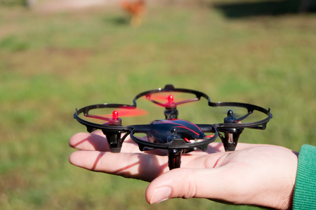 Playing the small quadrocopterrel in the yard.の写真素材