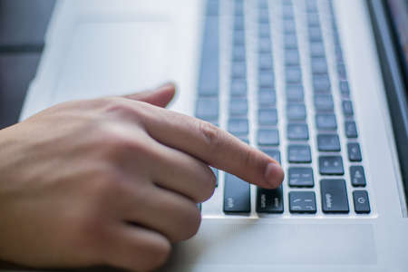 Hands typing on keyboard closeupの写真素材