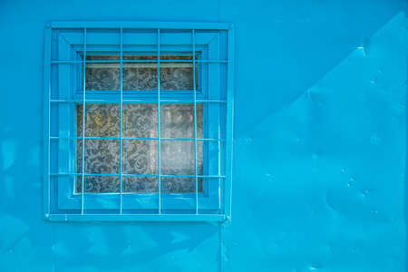 The window with a lacy curtain at the workmen's shelterの写真素材