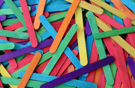 Multicolored  sticks in bulk in shades of purple red light blue yellow orange green for desktop background fの写真素材