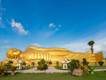 Huge golden sleeping Buddha with blue sky at Songkhla Thailandの写真素材