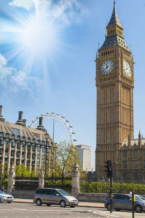 The clock tower of London, Big Ben and the London Eye in the background の写真素材