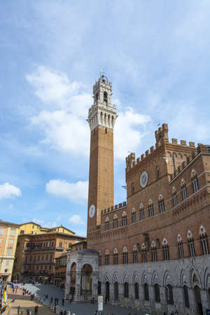 The Torre del Mangia and Piazza del Campo, Siena, Tuscany, Italy の写真素材