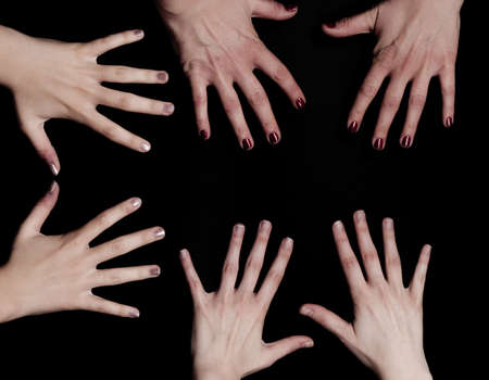 Hands on black background の写真素材