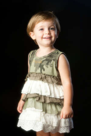 Smiling little girl with camouflage dress.のeditorial素材