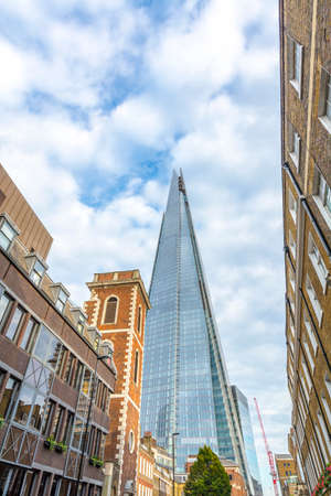 New skyscraper between old buildings.の写真素材