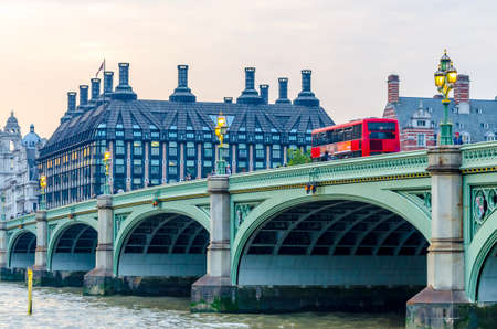 Red doubledecker bus on Westminster Bridge.の写真素材