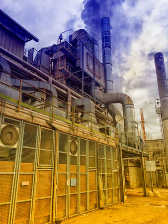 Shiny industrial equipment with pipes, wires and other connections at the factory.の写真素材