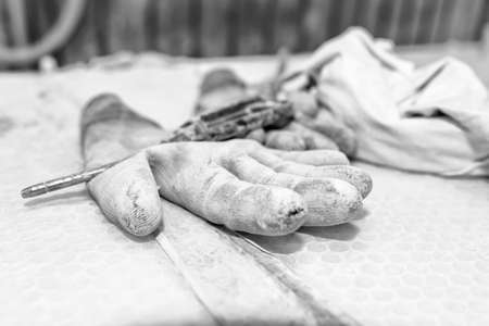 Gloves dirty and worn out from work.の写真素材