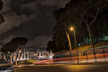 Traffic by nigh near the colosseum, Rome.の写真素材