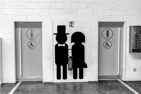Toilette sign in Beauvais TillÃ¨ airport.のeditorial素材