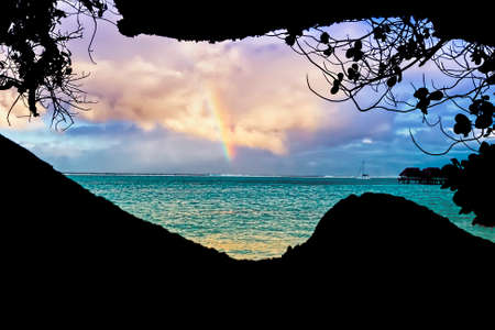 Rainbow view from a cave in Polynesia.の写真素材