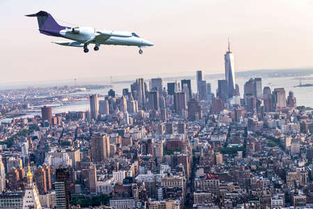 Plane over Manhattan, NYC.の写真素材