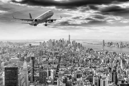 Airplane over Manhattan, NYC.の写真素材
