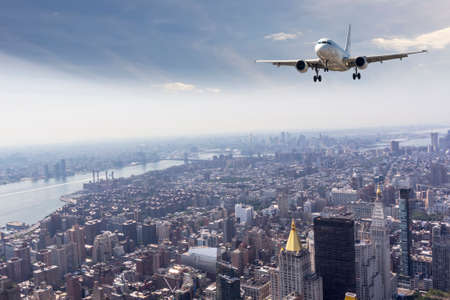 Airplane over Manhattan, NYC.の写真素材