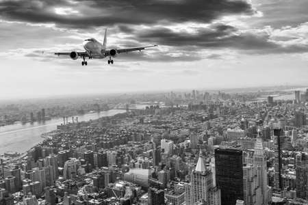 Airplane over Manhattan, NYC.の写真素材