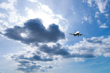 Airplane during landing with beautiful sky.