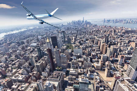 Airplane over Manhattan, NYC.の写真素材