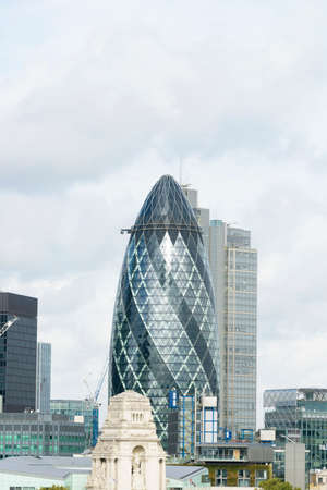 LONDON - SEPTEMBER 25: View of Gherkin building (30 St Mary Axe) at sunset in London on September 25, 2016. Gherkin - iconic symbol of London, one of city's most widely recognized examples of modern architecture.のeditorial素材