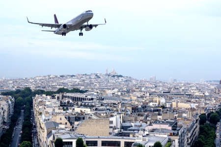 Airplane over Paris.の写真素材