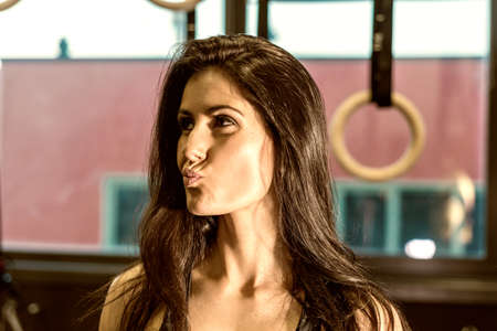 Young woman after workout in the gym.