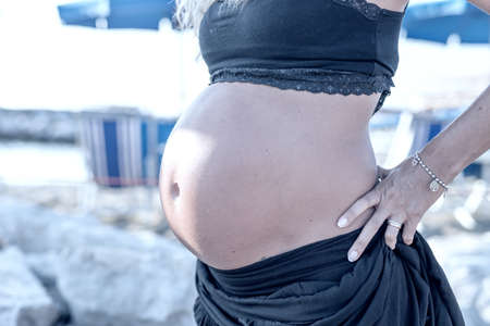 Pregnant woman on the beach.