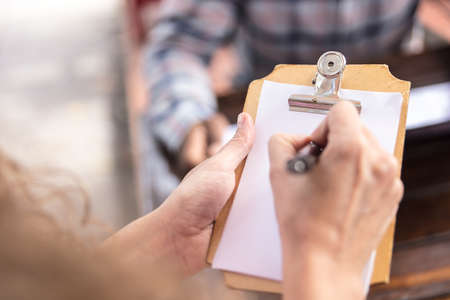 Detail of Notepad to write the orders of the Coffee bakery shop.の写真素材