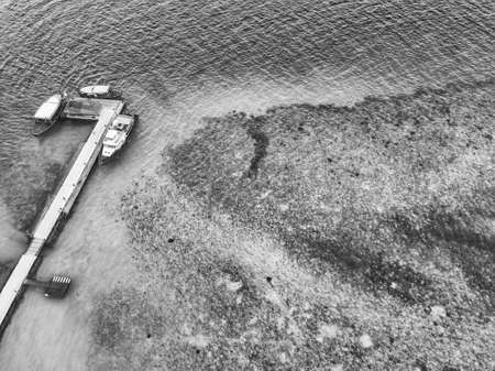 Aerial view of the docking dock of the boats and the reef around.