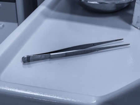 Medical tongs after a dressing.