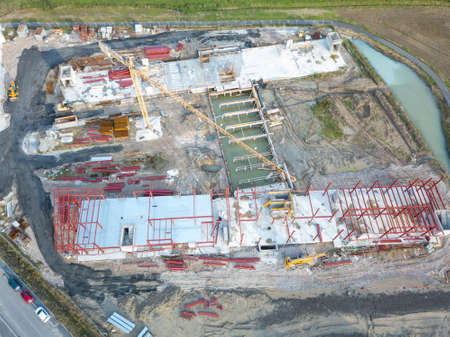 Construction work on the site, aerial view from top down of health buildings.