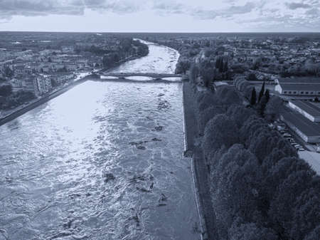 Aerial view of Pisa and the Arno river during a flood, Tuscany, Italy.