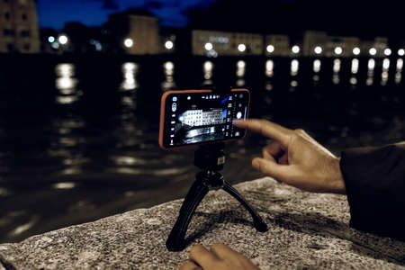 Smartphone, settings picture during the flood of the Arno river, Pisa, Italy.