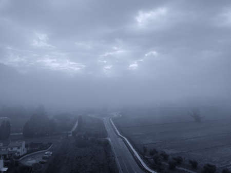 Aerial view street in the fog, Tuscany.