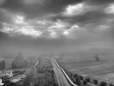 Aerial view street in the fog, Tuscany.