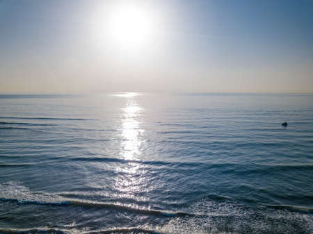 Aerial view of sunset over the sea photos taken by the drone.の写真素材