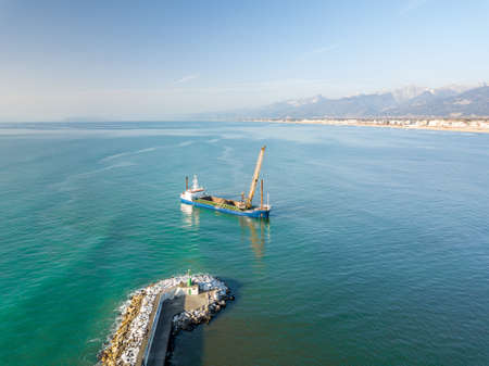 Aerial view from the drone of a dredging vessel seabed.の写真素材