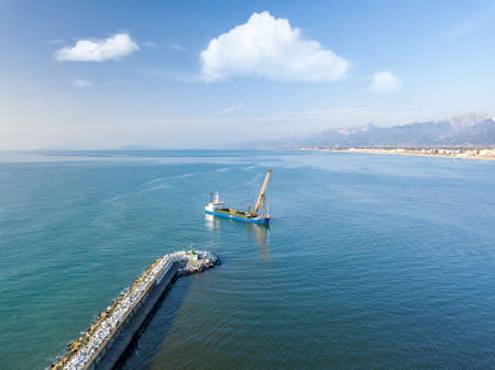 Aerial view from the drone of a dredging vessel seabed.の写真素材