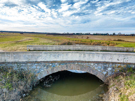 Small and old bridge in the Tuscan countryside.の写真素材