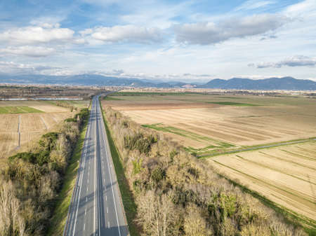 Aerial drone view of the highway between country areas, Tuscany, Italy.の写真素材