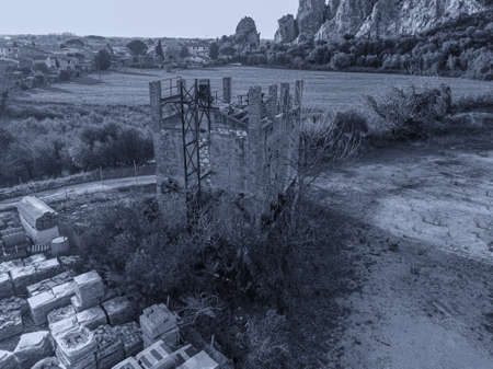 Old tower crushing rocks in abandonment.の写真素材