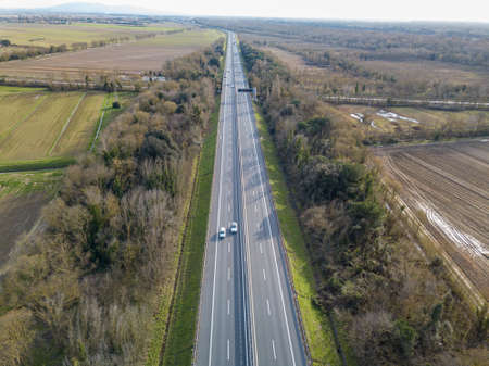 Aerial drone view of the highway between country areas, Tuscany, Italy.の写真素材