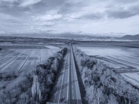 Aerial drone view of the highway between country areas, Tuscany, Italy.の写真素材