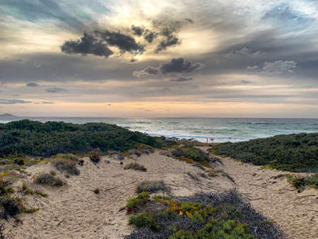Sunset with beautiful cloudy skies among the sand dunes, Sardinia, Italy. の写真素材