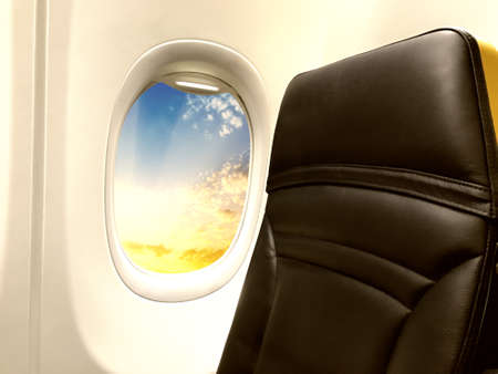 Airplane window with view on a beautiful sky.の写真素材