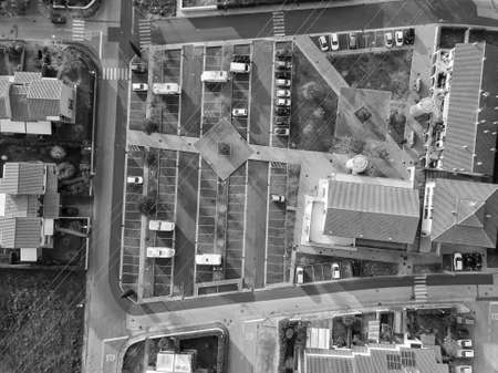 Aerial view fron drone about a parking with cars.の写真素材