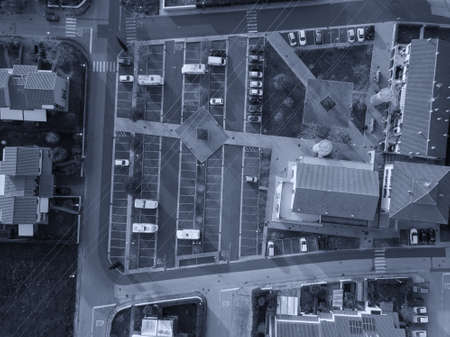 Aerial view fron drone about a parking with cars.の写真素材